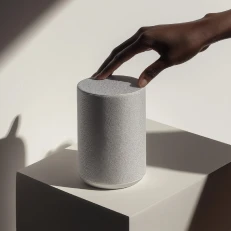 A cylindrical product on a lit podium